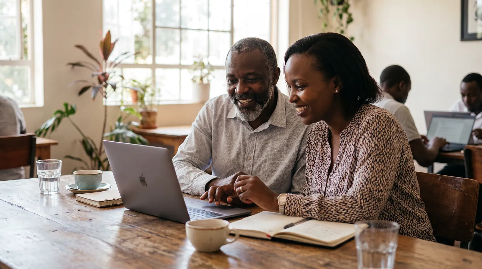 An advisor and a founder working together at a laptop